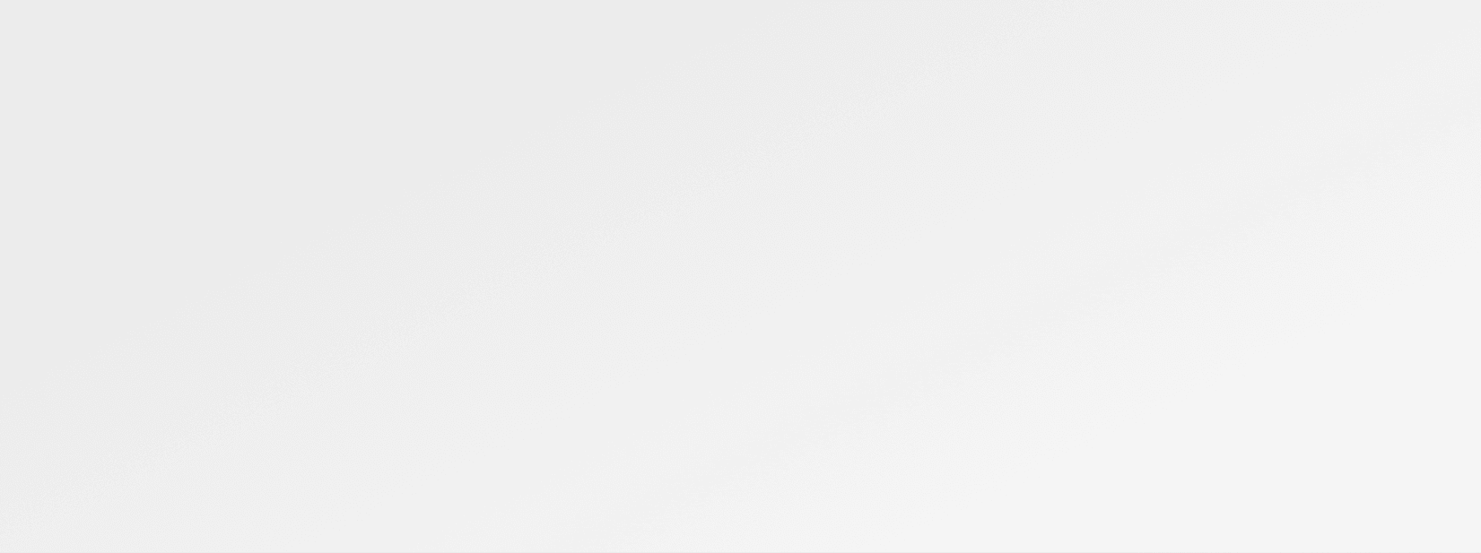Light gray textured background with subtle variations in tone creating a neutral, minimalist surface.